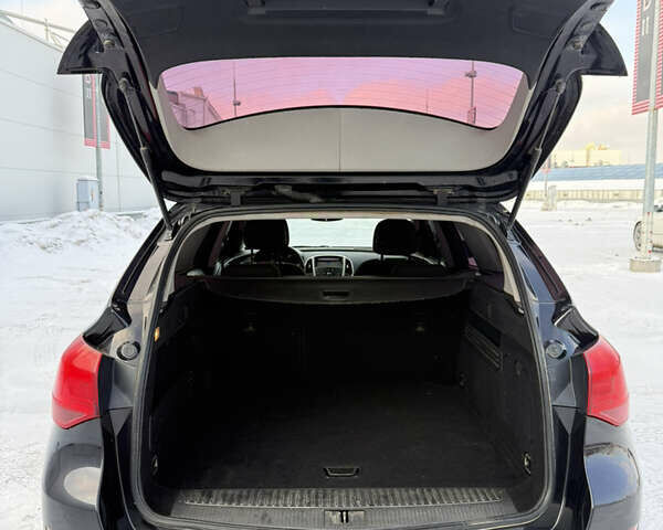 Черный Опель Астра, объемом двигателя 1.3 л и пробегом 257 тыс. км за 5700 $, фото 24 на Automoto.ua