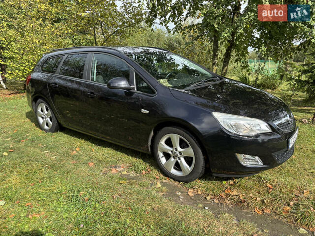 Чорний Опель Астра, об'ємом двигуна 1.25 л та пробігом 243 тис. км за 8150 $, фото 1 на Automoto.ua
