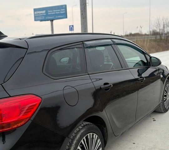 Черный Опель Астра, объемом двигателя 1.25 л и пробегом 230 тыс. км за 4700 $, фото 4 на Automoto.ua