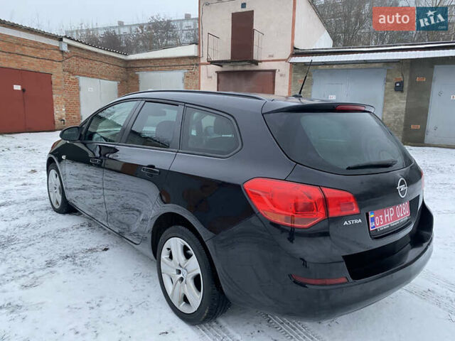 Черный Опель Астра, объемом двигателя 1.6 л и пробегом 230 тыс. км за 7300 $, фото 5 на Automoto.ua