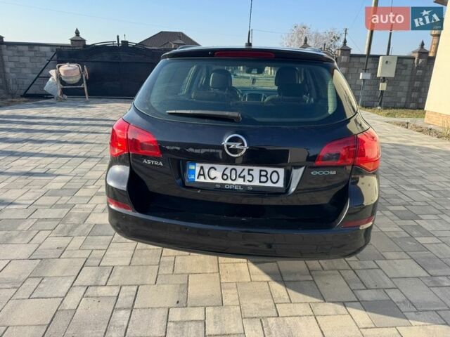 Черный Опель Астра, объемом двигателя 1.25 л и пробегом 300 тыс. км за 4950 $, фото 11 на Automoto.ua