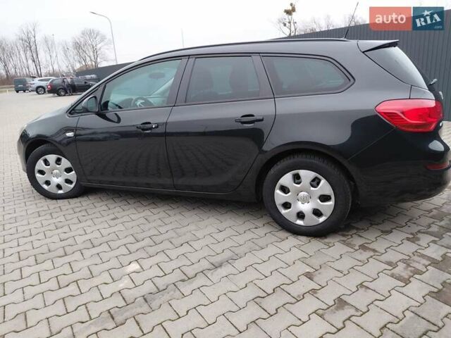 Черный Опель Астра, объемом двигателя 1.25 л и пробегом 1 тыс. км за 6200 $, фото 25 на Automoto.ua