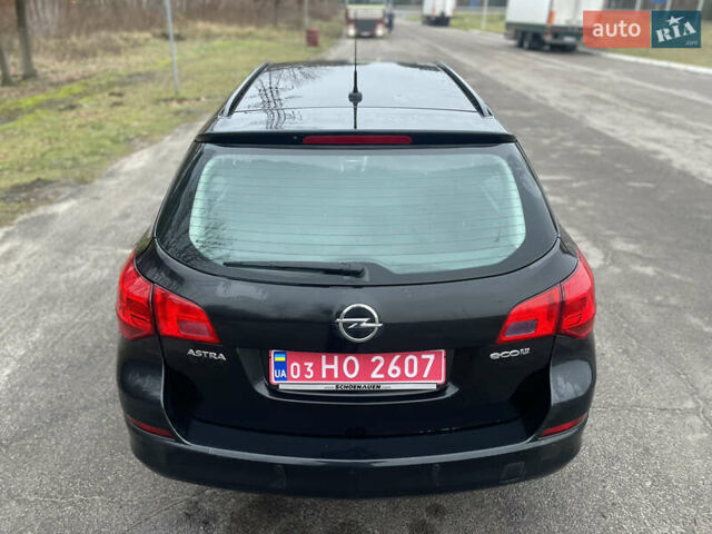 Черный Опель Астра, объемом двигателя 1.4 л и пробегом 210 тыс. км за 5900 $, фото 8 на Automoto.ua