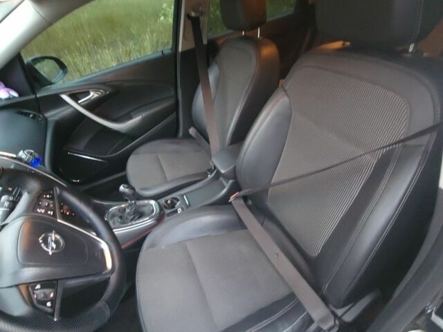 Черный Опель Астра, объемом двигателя 1.2 л и пробегом 180 тыс. км за 7200 $, фото 6 на Automoto.ua