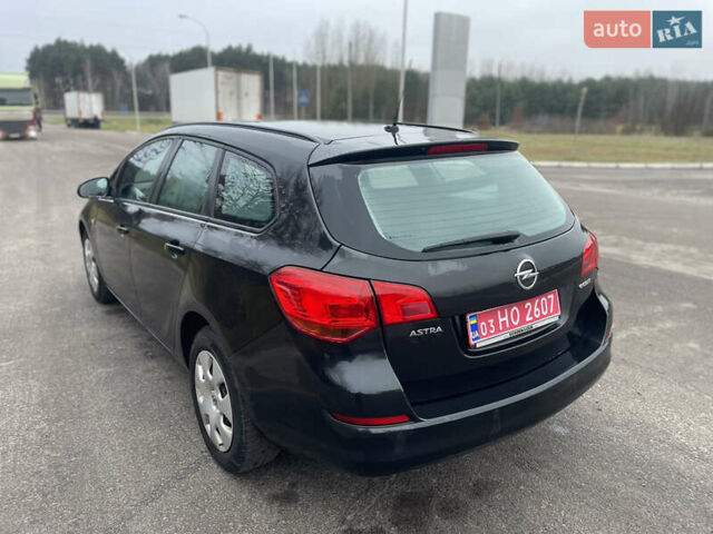 Черный Опель Астра, объемом двигателя 1.4 л и пробегом 210 тыс. км за 5900 $, фото 7 на Automoto.ua