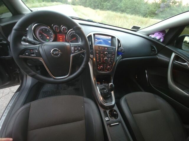 Черный Опель Астра, объемом двигателя 1.2 л и пробегом 180 тыс. км за 7200 $, фото 8 на Automoto.ua