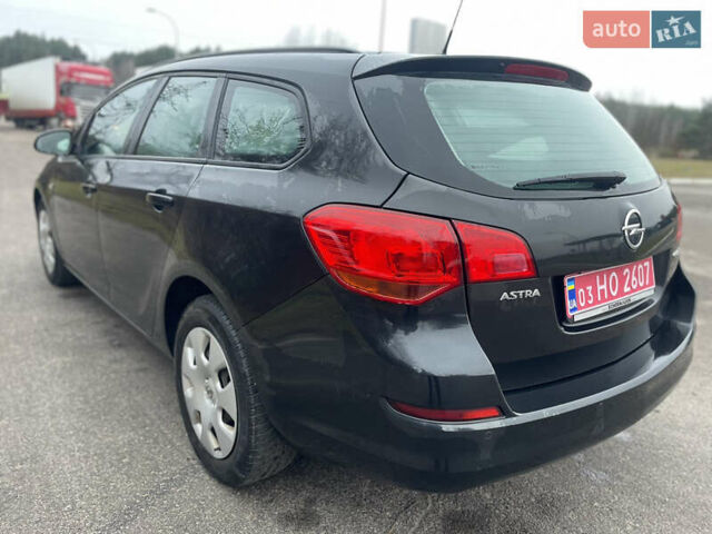 Черный Опель Астра, объемом двигателя 1.4 л и пробегом 210 тыс. км за 5900 $, фото 11 на Automoto.ua