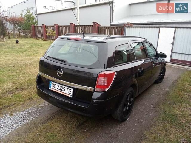 Черный Опель Астра, объемом двигателя 1.69 л и пробегом 260 тыс. км за 5600 $, фото 4 на Automoto.ua