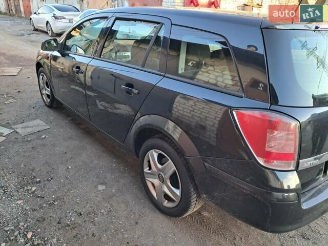 Черный Опель Астра, объемом двигателя 1.6 л и пробегом 318 тыс. км за 5400 $, фото 7 на Automoto.ua