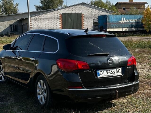 Черный Опель Астра, объемом двигателя 1.7 л и пробегом 309 тыс. км за 5600 $, фото 7 на Automoto.ua