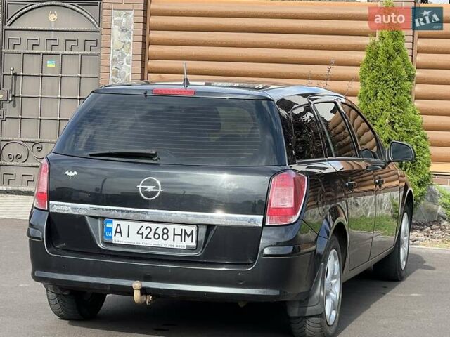 Черный Опель Астра, объемом двигателя 1.6 л и пробегом 145 тыс. км за 6400 $, фото 16 на Automoto.ua