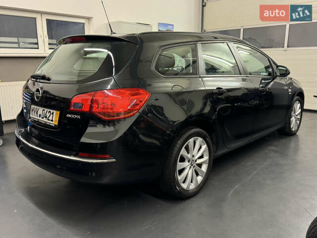 Черный Опель Астра, объемом двигателя 1.4 л и пробегом 203 тыс. км за 7250 $, фото 2 на Automoto.ua