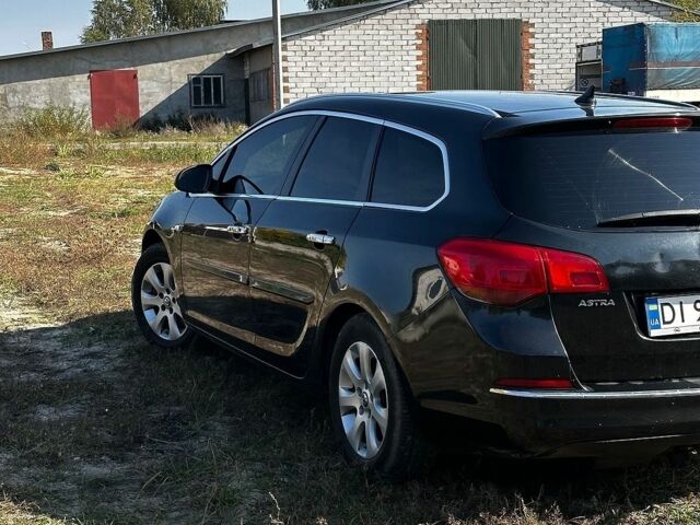 Черный Опель Астра, объемом двигателя 1.7 л и пробегом 309 тыс. км за 5600 $, фото 6 на Automoto.ua