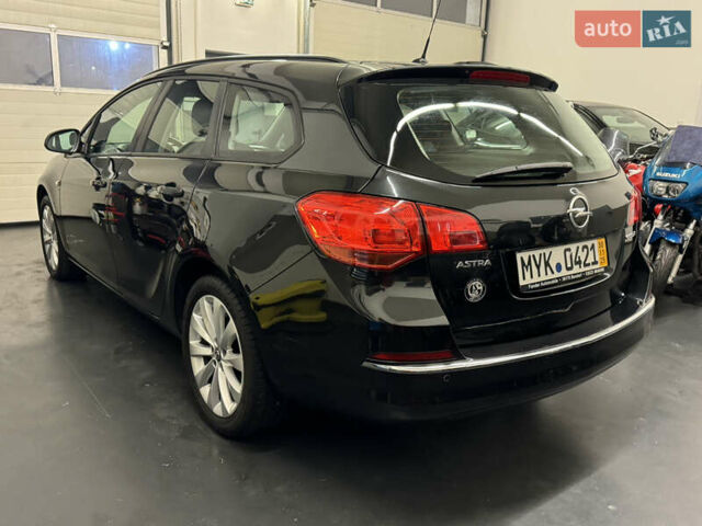 Черный Опель Астра, объемом двигателя 1.4 л и пробегом 203 тыс. км за 7250 $, фото 4 на Automoto.ua