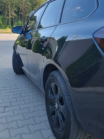 Черный Опель Астра, объемом двигателя 1.6 л и пробегом 235 тыс. км за 7700 $, фото 1 на Automoto.ua