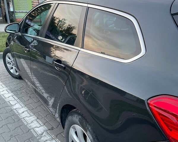 Черный Опель Астра, объемом двигателя 1.6 л и пробегом 234 тыс. км за 7800 $, фото 1 на Automoto.ua