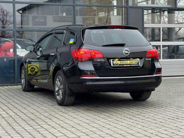 Черный Опель Астра, объемом двигателя 1.6 л и пробегом 145 тыс. км за 9600 $, фото 4 на Automoto.ua