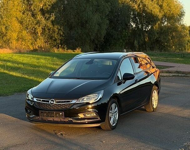 Черный Опель Астра, объемом двигателя 1.6 л и пробегом 128 тыс. км за 11299 $, фото 1 на Automoto.ua