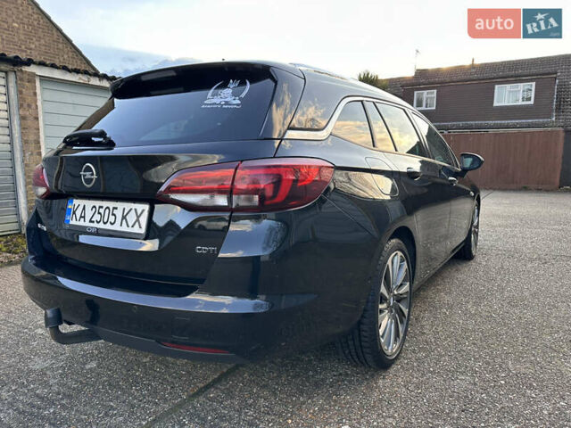 Черный Опель Астра, объемом двигателя 1.6 л и пробегом 142 тыс. км за 12000 $, фото 4 на Automoto.ua