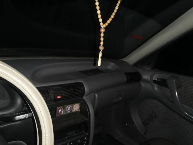 Красный Опель Астра, объемом двигателя 1.4 л и пробегом 350 тыс. км за 1700 $, фото 5 на Automoto.ua