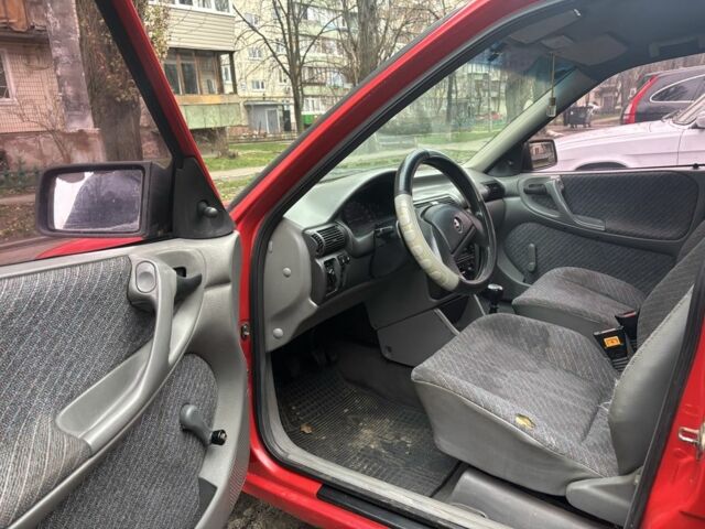 Красный Опель Астра, объемом двигателя 1.4 л и пробегом 300 тыс. км за 999 $, фото 6 на Automoto.ua