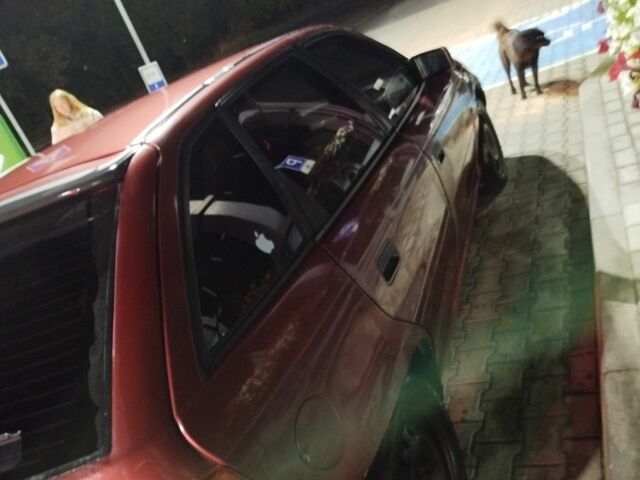 Красный Опель Астра, объемом двигателя 1.6 л и пробегом 317 тыс. км за 1100 $, фото 5 на Automoto.ua