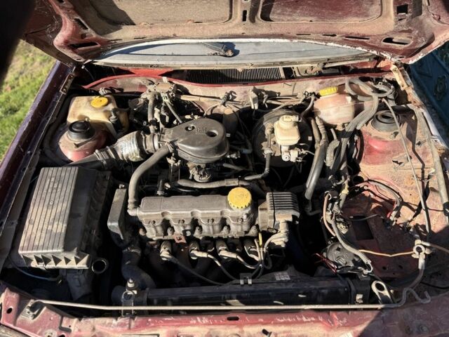 Красный Опель Астра, объемом двигателя 1.6 л и пробегом 400 тыс. км за 550 $, фото 5 на Automoto.ua