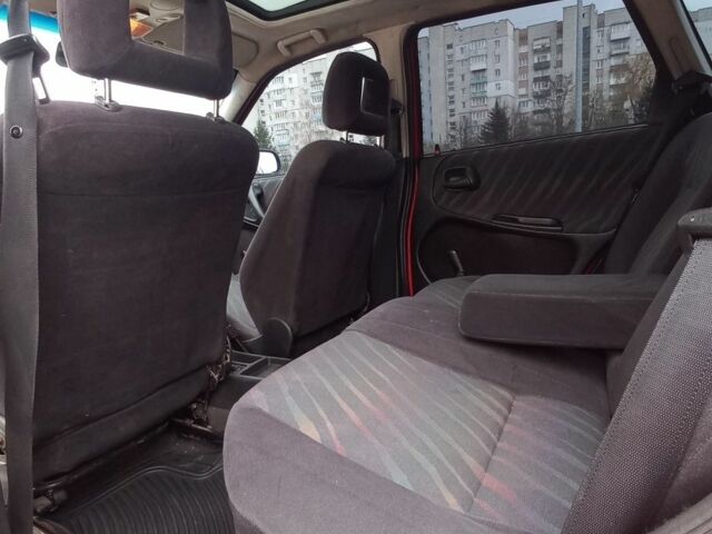 Красный Опель Астра, объемом двигателя 1.6 л и пробегом 396 тыс. км за 1299 $, фото 14 на Automoto.ua