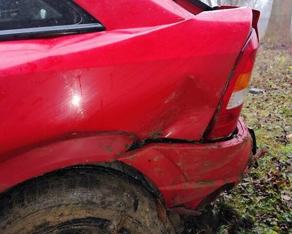 Красный Опель Астра, объемом двигателя 1.8 л и пробегом 209 тыс. км за 1700 $, фото 7 на Automoto.ua