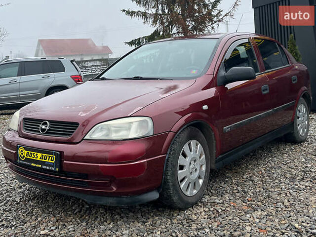 Красный Опель Астра, объемом двигателя 1.6 л и пробегом 294 тыс. км за 3699 $, фото 2 на Automoto.ua