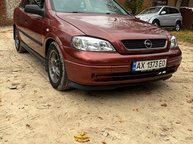 Красный Опель Астра, объемом двигателя 1.4 л и пробегом 250 тыс. км за 2800 $, фото 2 на Automoto.ua