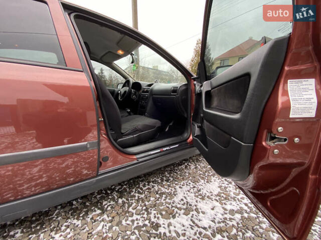 Красный Опель Астра, объемом двигателя 1.2 л и пробегом 327 тыс. км за 3200 $, фото 6 на Automoto.ua