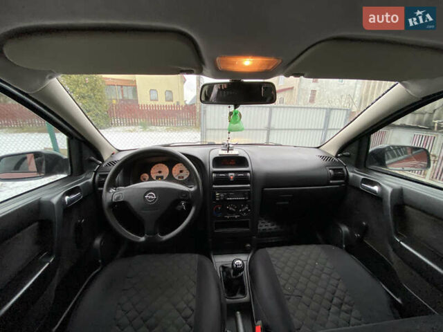 Красный Опель Астра, объемом двигателя 1.2 л и пробегом 327 тыс. км за 3200 $, фото 11 на Automoto.ua