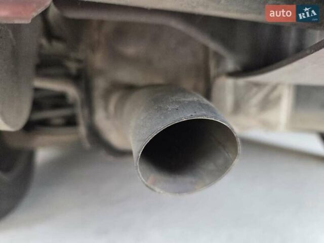 Красный Опель Астра, объемом двигателя 1.4 л и пробегом 114 тыс. км за 4100 $, фото 3 на Automoto.ua