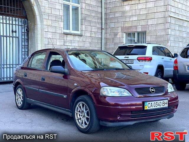 Красный Опель Астра, объемом двигателя 1.6 л и пробегом 250 тыс. км за 3300 $, фото 1 на Automoto.ua