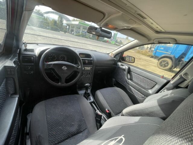 Красный Опель Астра, объемом двигателя 1.8 л и пробегом 300 тыс. км за 2200 $, фото 19 на Automoto.ua