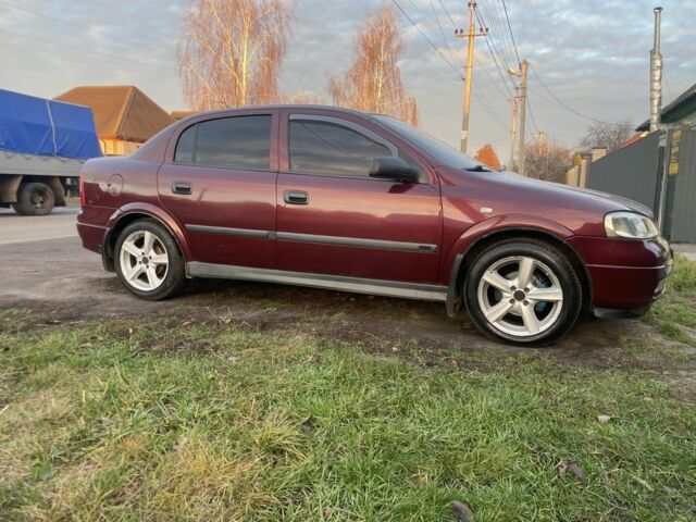 Красный Опель Астра, объемом двигателя 1.6 л и пробегом 270 тыс. км за 4000 $, фото 1 на Automoto.ua