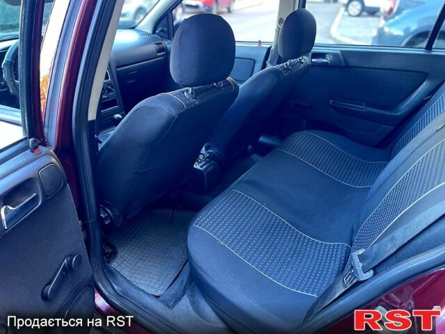 Красный Опель Астра, объемом двигателя 1.6 л и пробегом 250 тыс. км за 3300 $, фото 4 на Automoto.ua