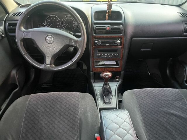 Красный Опель Астра, объемом двигателя 1.6 л и пробегом 270 тыс. км за 4000 $, фото 3 на Automoto.ua