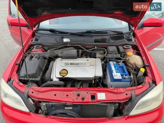 Красный Опель Астра, объемом двигателя 1.4 л и пробегом 247 тыс. км за 3200 $, фото 18 на Automoto.ua