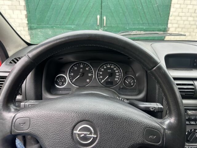 Червоний Опель Астра, об'ємом двигуна 1.7 л та пробігом 244 тис. км за 948 $, фото 2 на Automoto.ua