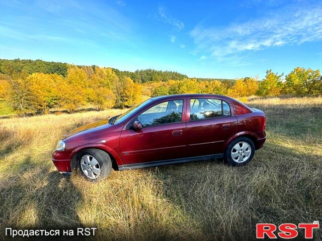 Красный Опель Астра, объемом двигателя 1.6 л и пробегом 149 тыс. км за 4000 $, фото 1 на Automoto.ua