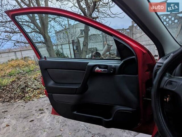 Красный Опель Астра, объемом двигателя 1.36 л и пробегом 207 тыс. км за 3650 $, фото 8 на Automoto.ua