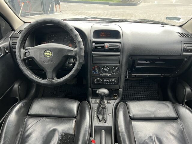 Красный Опель Астра, объемом двигателя 1.6 л и пробегом 324 тыс. км за 1500 $, фото 7 на Automoto.ua