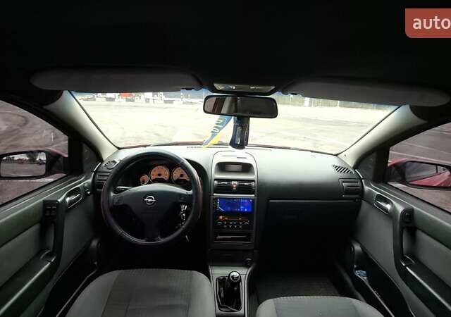 Красный Опель Астра, объемом двигателя 1.6 л и пробегом 220 тыс. км за 3300 $, фото 12 на Automoto.ua