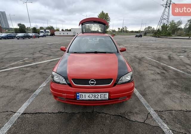 Красный Опель Астра, объемом двигателя 1.6 л и пробегом 220 тыс. км за 3300 $, фото 5 на Automoto.ua