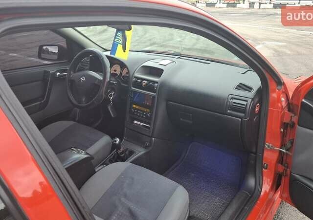 Красный Опель Астра, объемом двигателя 1.6 л и пробегом 220 тыс. км за 3300 $, фото 15 на Automoto.ua
