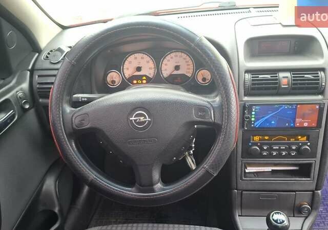 Красный Опель Астра, объемом двигателя 1.6 л и пробегом 220 тыс. км за 3300 $, фото 16 на Automoto.ua