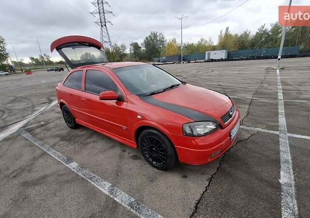 Красный Опель Астра, объемом двигателя 1.6 л и пробегом 220 тыс. км за 3300 $, фото 7 на Automoto.ua
