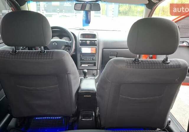 Красный Опель Астра, объемом двигателя 1.6 л и пробегом 220 тыс. км за 3300 $, фото 13 на Automoto.ua